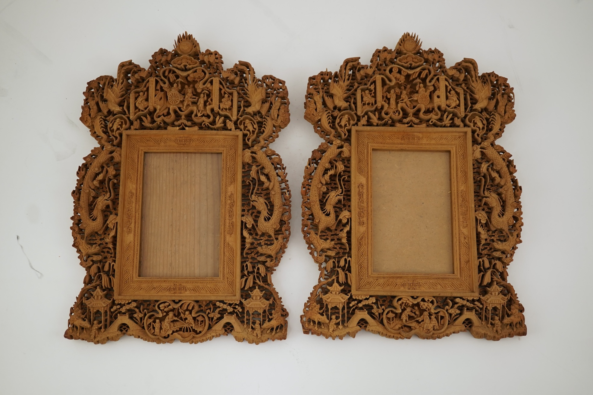 A pair of Chinese carved sandalwood frames, late 19th century